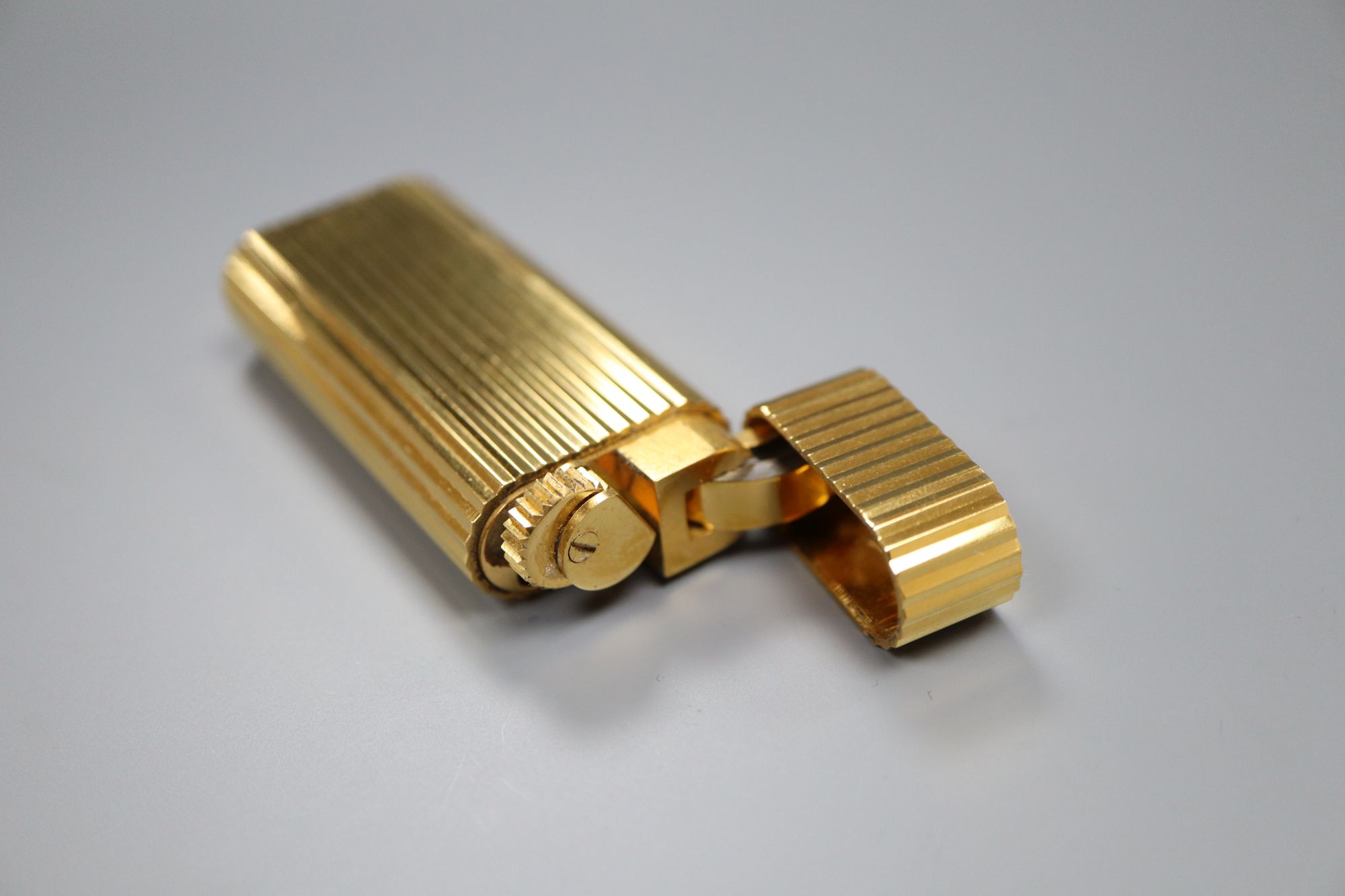 A cased Must de Cartier gold plated lighter